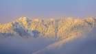 USA- Washington State. Sunrise on snow-covered mountains in Olympic National Forest. Art Print